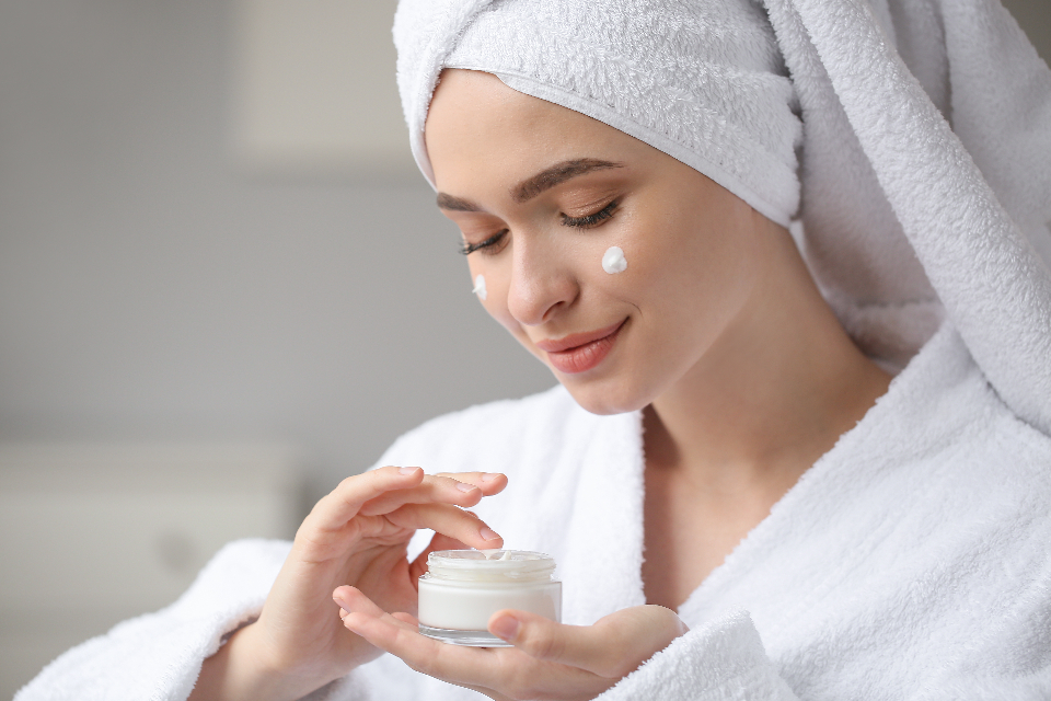 Woman receiving a facial treatment at home